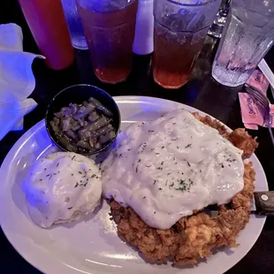 chicken fried with gravy and mashed potatoes