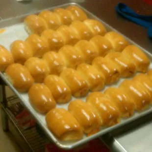a tray of glazed donuts