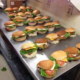 a table full of sandwiches