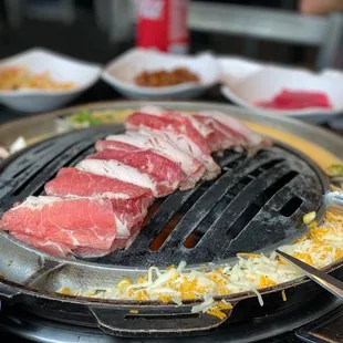 a closeup of the meat being cooked on the grill