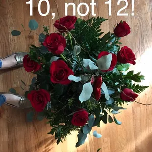 Paid over $100 for one dozen yet arrangement clearly has TEN roses plus a plastic heart.  Roses had droopy necks by day for or five.