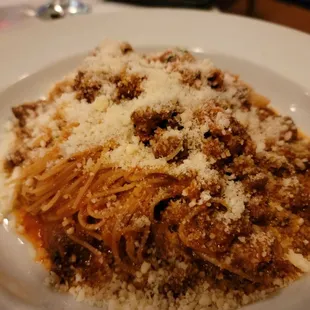ows a pasta dish with meat and cheese