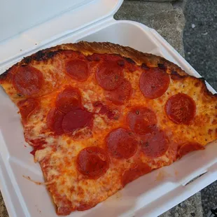 a slice of pepperoni pizza