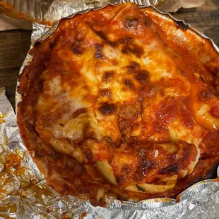 a cheese pizza on tin foil