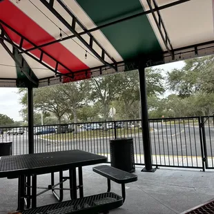 Covered Outside patio area with 9-10 tables