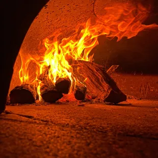 a fire in a brick oven