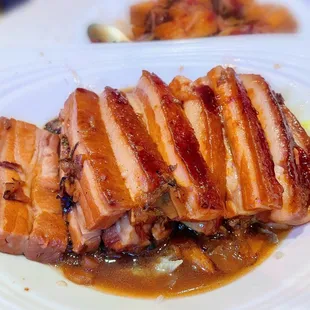 a plate of meat with sauce