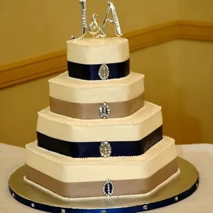 The icing on this four tiered wedding cake has been mistaken for fondant but is actually butter cream.