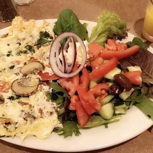 Mykonos omelette. Great that they put the red onions/feta cheese on its own so i can mix to my liking.