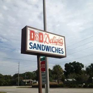 a sign for a sandwich shop