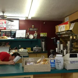 a man sleeping on a counter