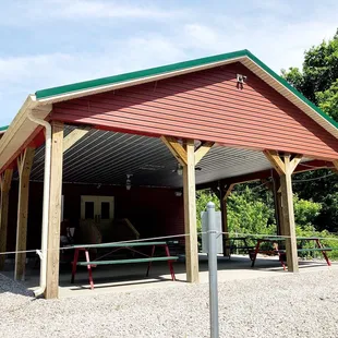 a red building with a green roof