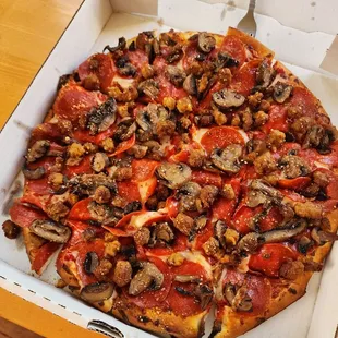 Pizza, pepperoni, sausage and mushrooms.