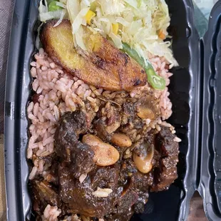 Oxtail, cabbage, rice and peas
