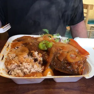 a man holding a plate of food