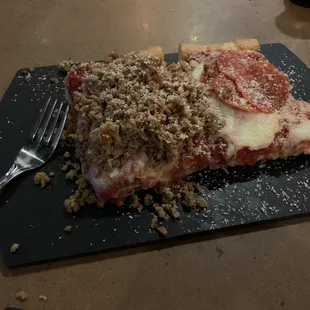 Two slices... one sausage and one pepperoni