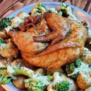 (Gluten free) Eddie Van Halen entree: Half Roasted chicken, garlic &amp; herb potatoes, fresh steamed broccoli drizzled w/ piping hot queso.