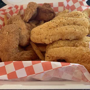a basket of fried fish and fries