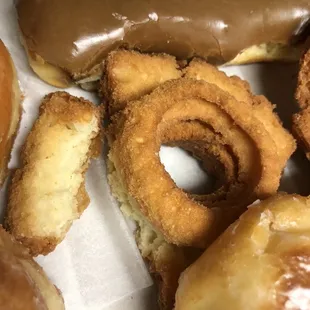 A broken half donut instead of the whole one next to it...