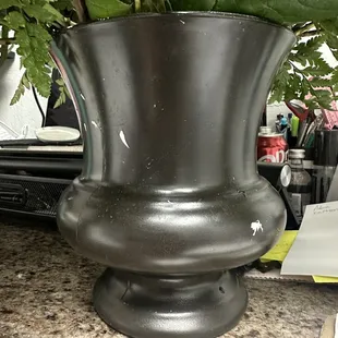 Just a few of the paint scratches on one side. The rim of the vase is also scratched and missing paint and the other side looks no better.