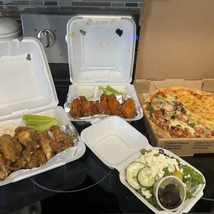 Lemon/pepper wings, hot buffalo wings, half cheese/half veggie pizza and a small Greek salad