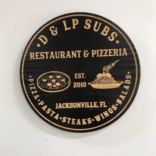 a sign for a restaurant and pizzaria