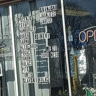 a storefront window with a sign in the window