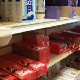 a shelf of chocolates and candy