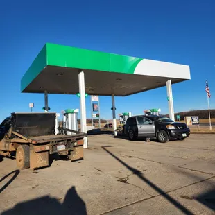 a truck parked in front of a gas station