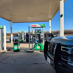 a gas station with gas pumps