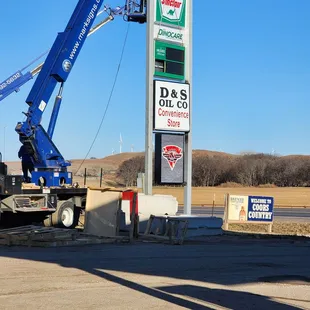 a crane working on a gas station