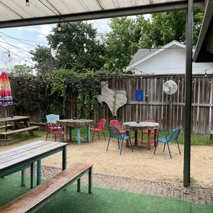 a picnic area with tables and umbrellas