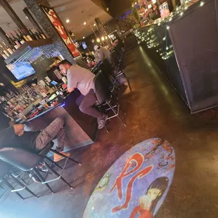 a man sitting at a bar