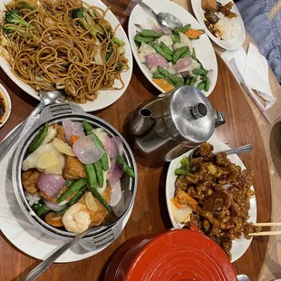 Left to right, vegetable lo mien, seafood tofu hotpot, sweet and sour pork chops and fish with snap peas