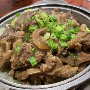 a bowl of beef and noodles