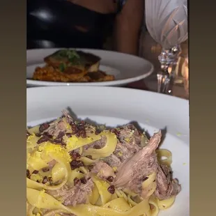 Duck pasta and branzino fish with couscous. Please excuse my spelling. Both meals were impeccable!