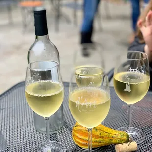 two glasses of wine and a bottle of wine