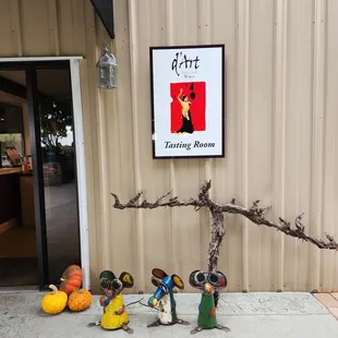 a group of figurines in front of a building