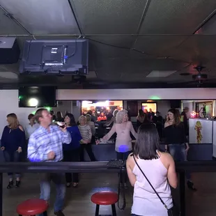 a group of people at a bar