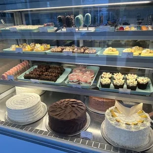 a display of cakes and pastries
