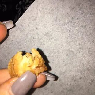 Lil crunchiness found in said steak bomb with cheese...Lil corner of chicken finger...