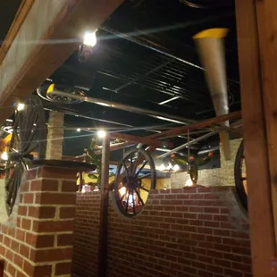 a brick wall with a fire hydrant hanging from it