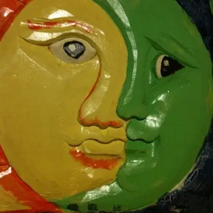 the face of a sun and a moon