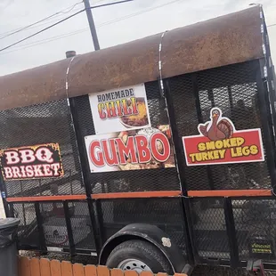 the side of a truck with stickers on it