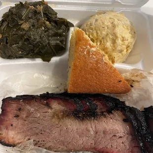 Brisket plate with collard greens, potato salad, and corn bread. Also comes with a drink and dessert.