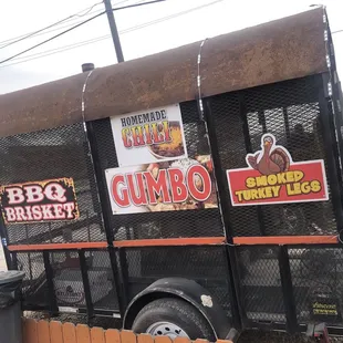 the side of a truck with stickers on it