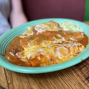 a plate of enchiladas on a table