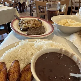 Bistec Palomilla-steak Sweet plantains Casava in garlic mojo Cuban style black beans Rice