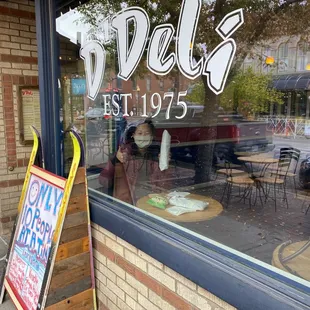 a sign in front of a restaurant