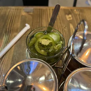 Jalapeños, not too spicy. May be pickled?